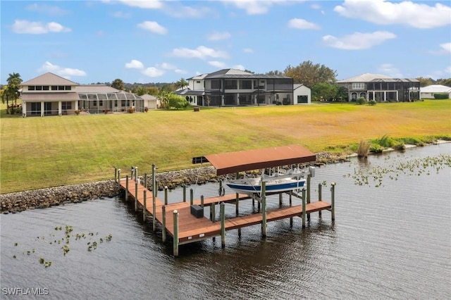 view of dock with a water view and a lawn