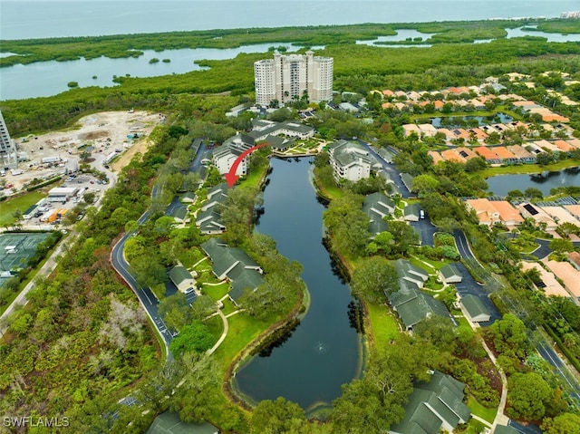 birds eye view of property with a water view