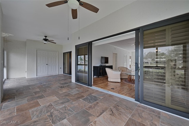 view of patio featuring ceiling fan