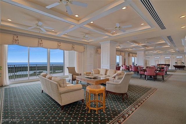 living room featuring beamed ceiling, a water view, carpet flooring, ceiling fan, and coffered ceiling