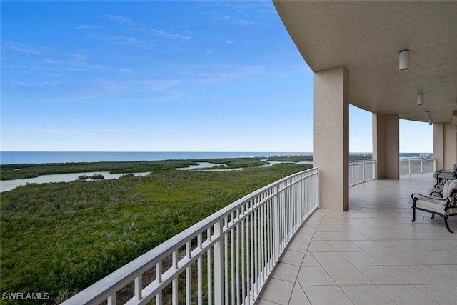 balcony featuring a water view