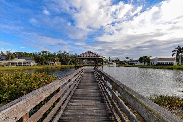 view of dock featuring a water view and a gazebo