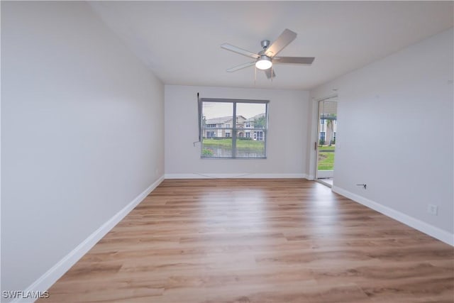 empty room featuring ceiling fan and light hardwood / wood-style flooring