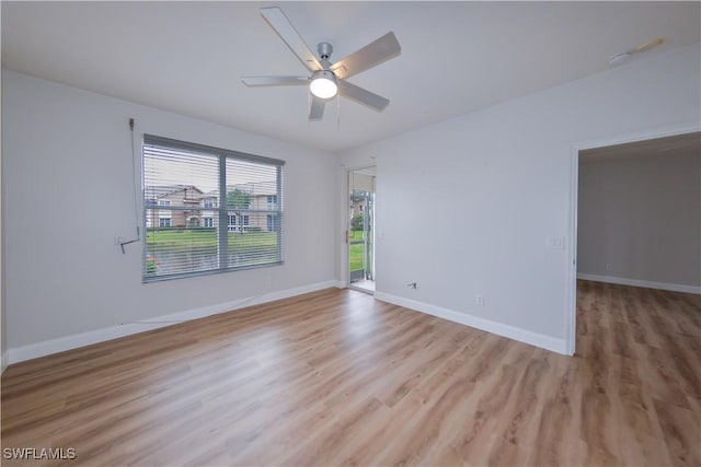 spare room featuring light hardwood / wood-style floors and ceiling fan