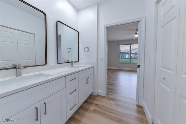 bathroom featuring ceiling fan, vanity, and hardwood / wood-style flooring