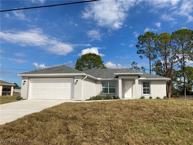 single story home with a front lawn and a garage