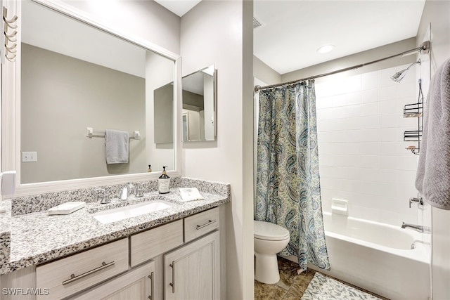 full bathroom featuring shower / bath combination with curtain, vanity, and toilet