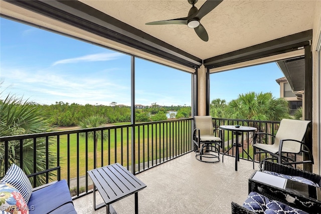 sunroom / solarium with ceiling fan