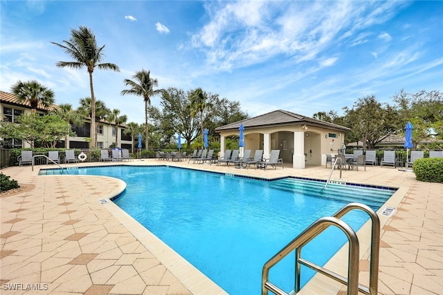 view of swimming pool with a patio area