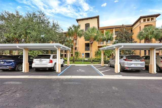 view of vehicle parking featuring a carport