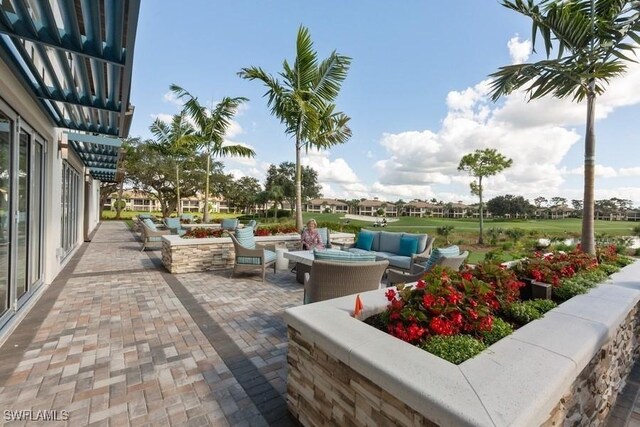 view of patio featuring a pergola and an outdoor living space