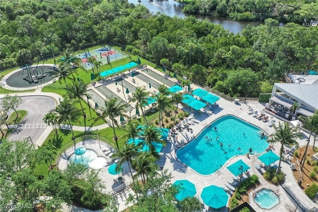 birds eye view of property with a water view