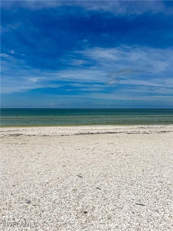 property view of water featuring a beach view