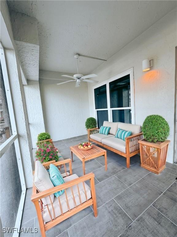 exterior space with a ceiling fan and an outdoor hangout area