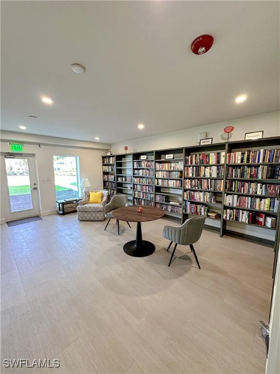 25740 Hickory Blvd Unit 142, Bonita Springs, FL 34134 - sitting room with recessed lighting and wall of books