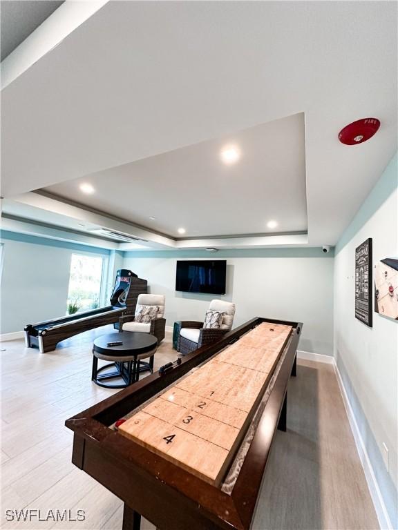 25740 Hickory Blvd Unit 142, Bonita Springs, FL 34134 - game room with a raised ceiling, baseboards, recessed lighting, and wood finished floors