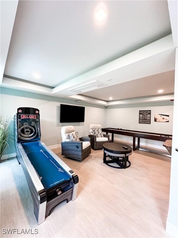 25740 Hickory Blvd Unit 142, Bonita Springs, FL 34134 - game room featuring baseboards, a tray ceiling, recessed lighting, and wood finished floors