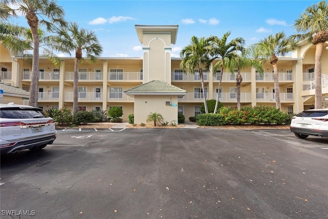 15495 Cedarwood Ln Unit 103, Naples, FL 34110 - view of apartment building / complex with uncovered parking
