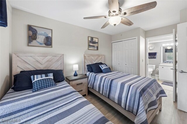 bedroom featuring ceiling fan, hardwood / wood-style floors, and a closet