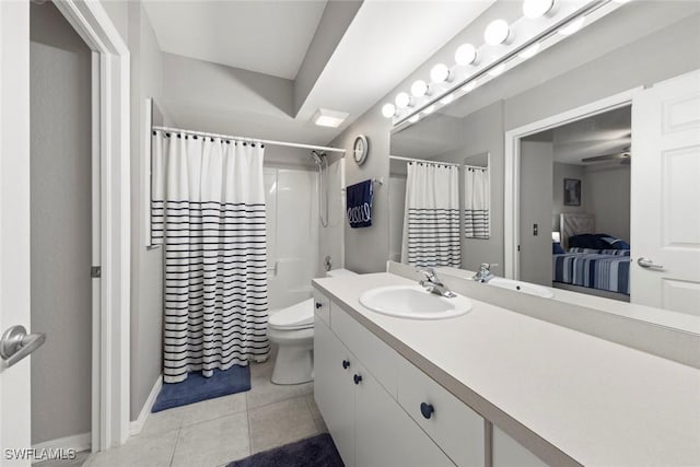 bathroom with toilet, vanity, tile patterned flooring, and curtained shower