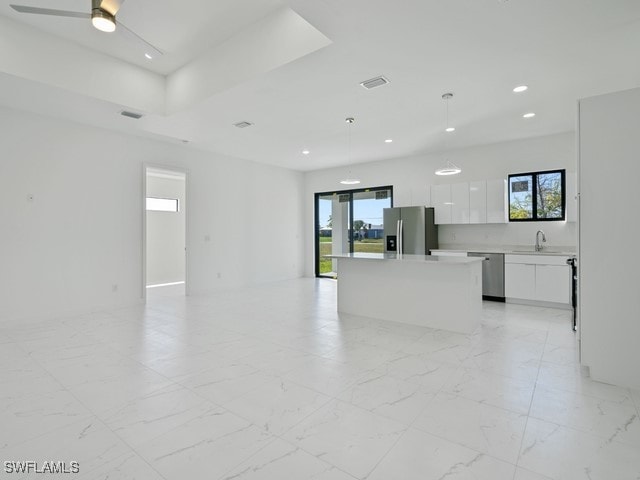 interior space featuring ceiling fan