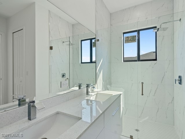 bathroom featuring vanity and walk in shower