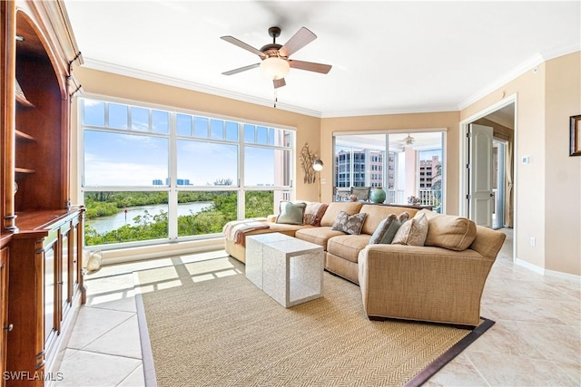 living room featuring ceiling fan, light tile patterned floors, crown molding, and a water view