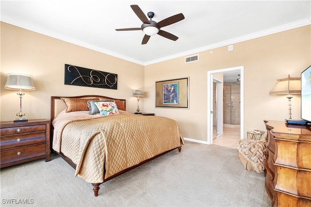 carpeted bedroom featuring ceiling fan, ensuite bathroom, and ornamental molding