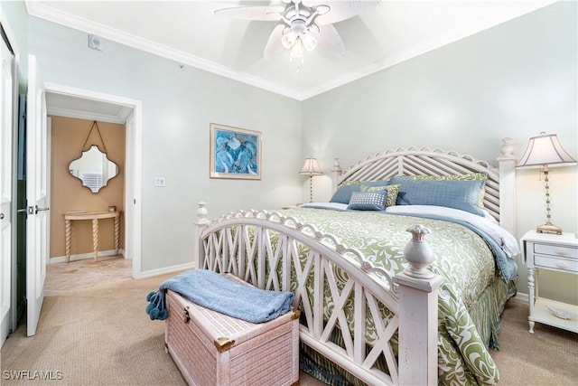 carpeted bedroom featuring ceiling fan and ornamental molding