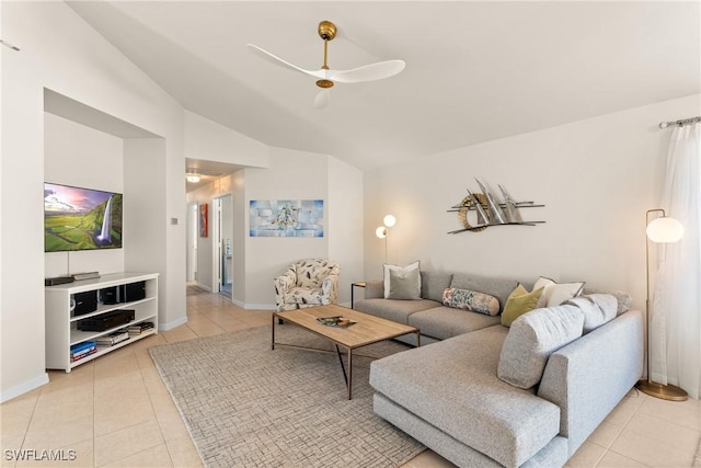 tiled living room with lofted ceiling and ceiling fan