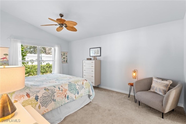 carpeted bedroom featuring lofted ceiling and ceiling fan