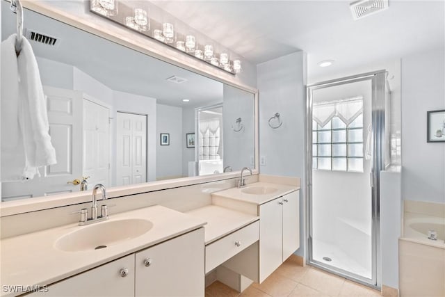 bathroom featuring separate shower and tub, tile patterned floors, and vanity