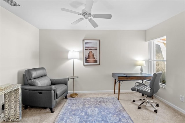 carpeted office with ceiling fan