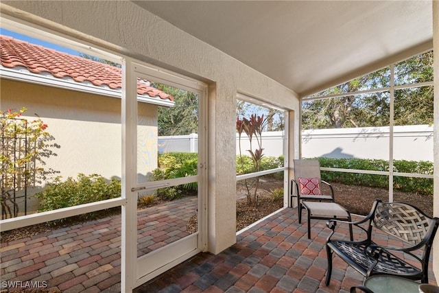 sunroom with lofted ceiling