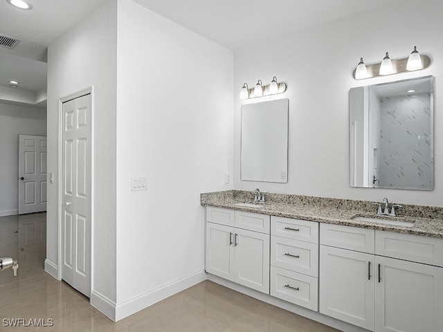 bathroom featuring tile patterned floors and vanity