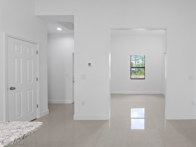 spare room featuring light tile patterned floors