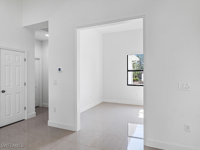 spare room with light tile patterned floors