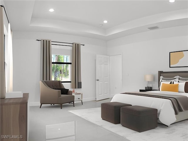 bedroom featuring a raised ceiling