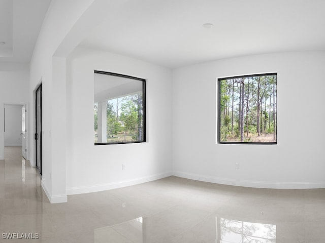 empty room with light tile patterned flooring