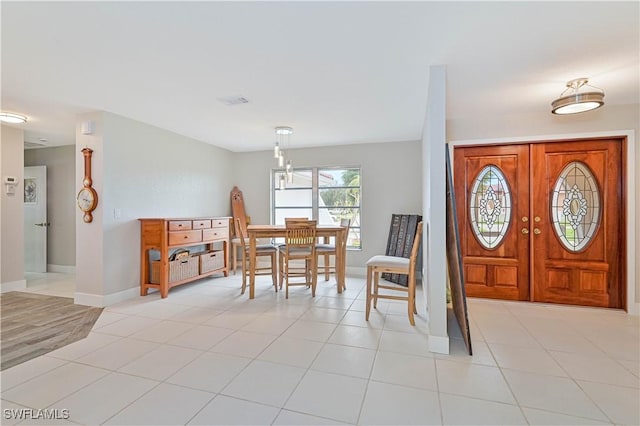 dining room with light tile patterned flooring