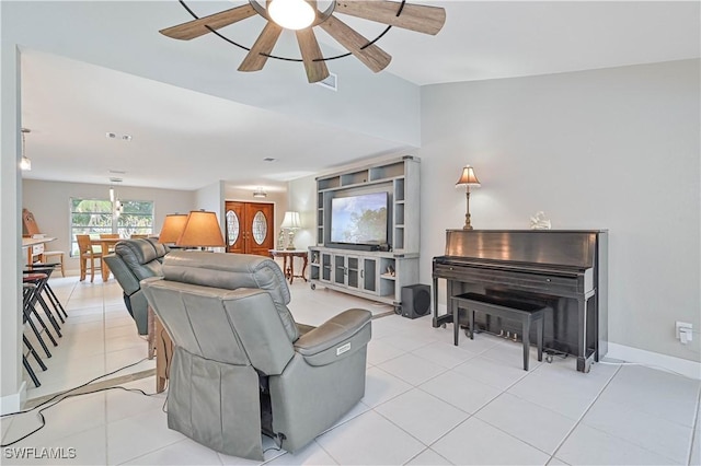 living room featuring ceiling fan and light tile patterned flooring