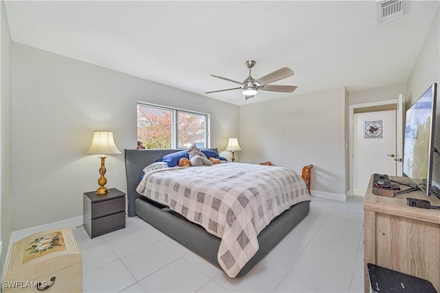 bedroom with ceiling fan and light tile patterned floors