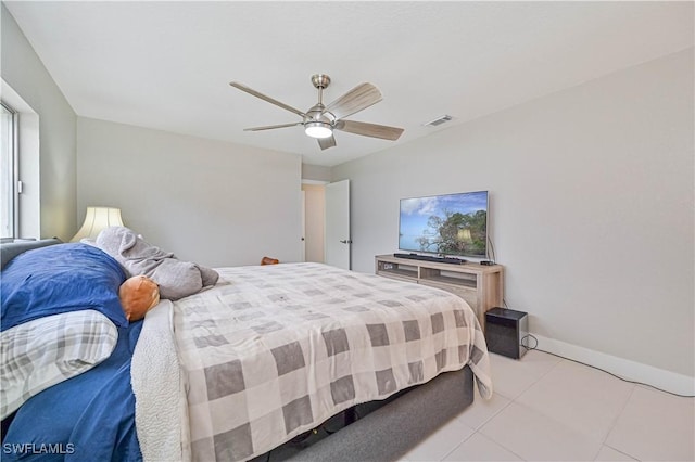 tiled bedroom with ceiling fan