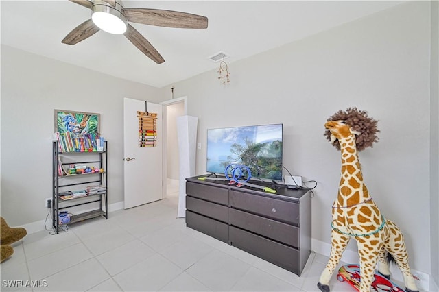 tiled bedroom with ceiling fan