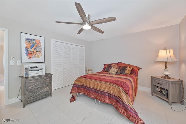 tiled bedroom featuring a closet and ceiling fan