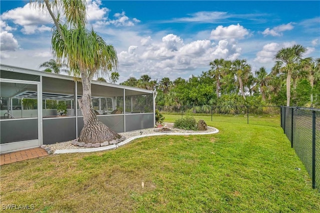 view of yard featuring a sunroom