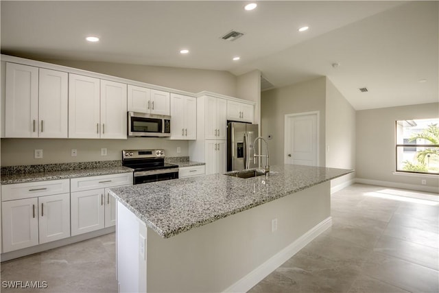 kitchen featuring white cabinets, a kitchen island with sink, and stainless steel appliances