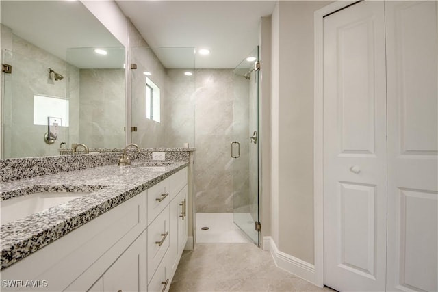 bathroom with walk in shower and vanity