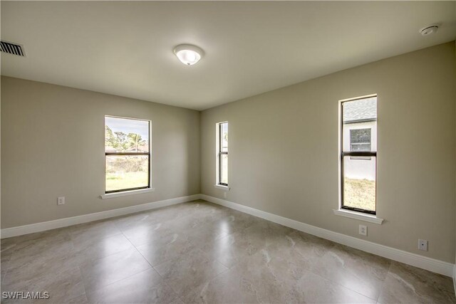 unfurnished room with a wealth of natural light