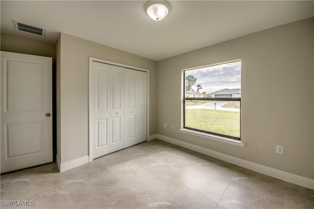 unfurnished bedroom featuring a closet